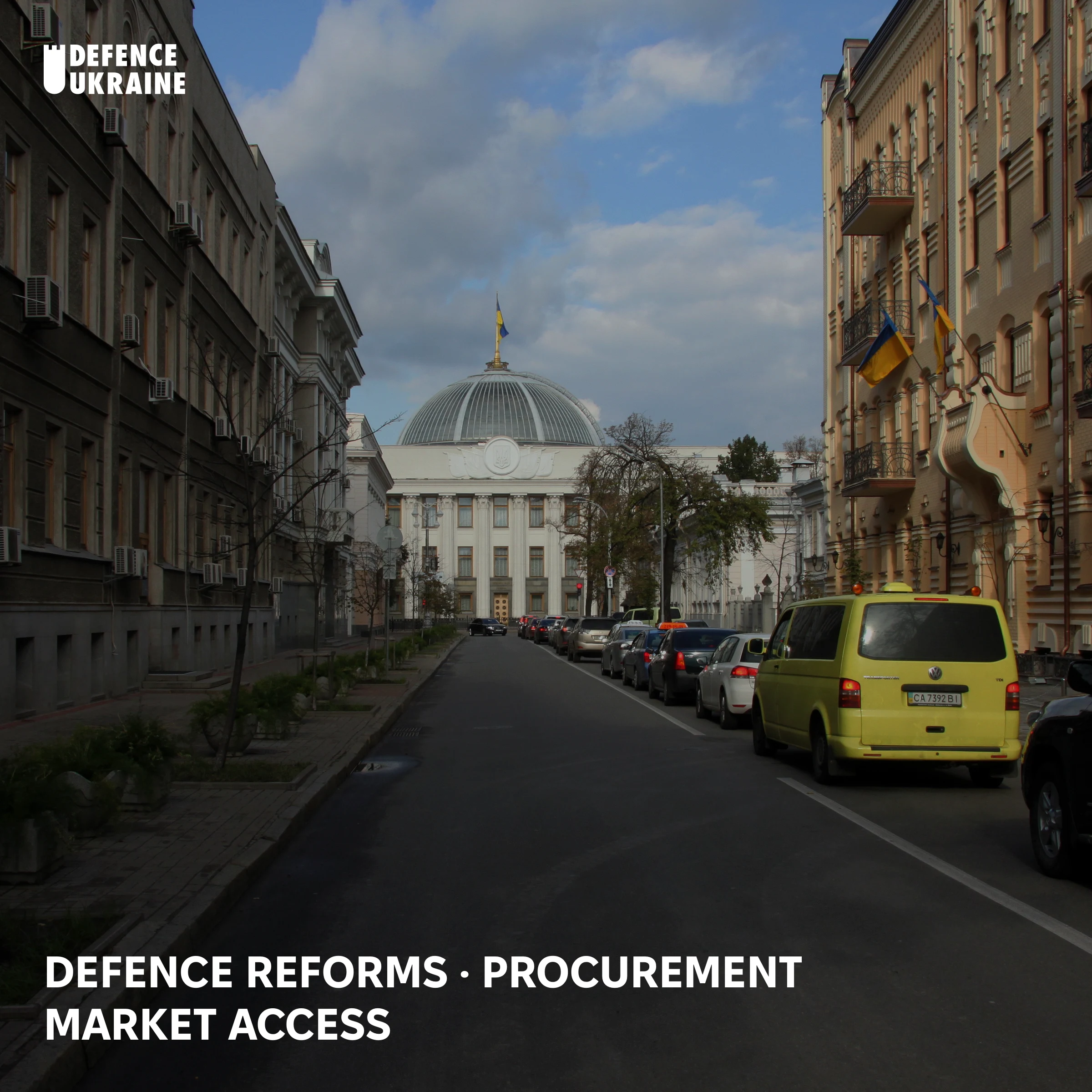The domed Verkhovna Rada parliament building in Kyiv seen down a tree-lined street, the setting for the confirmation vote that will decide whether Yevhenii Khmara becomes Ukraine's substantive Defence Minister.