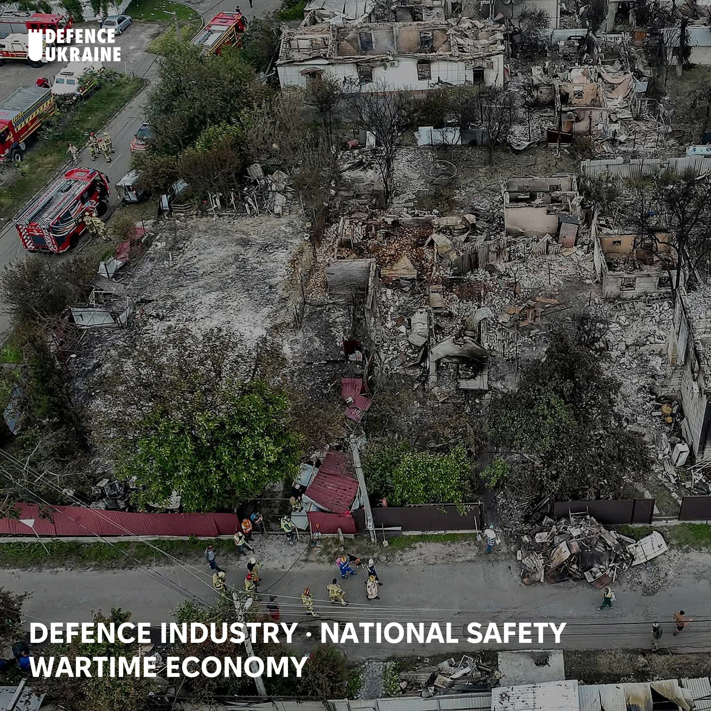 Aerial view of Vyshneve near Kyiv on 6 July 2026, where State Emergency Service fire engines and ambulances line the road beside a street of private houses burnt out by secondary detonations from the munitions store next to them.