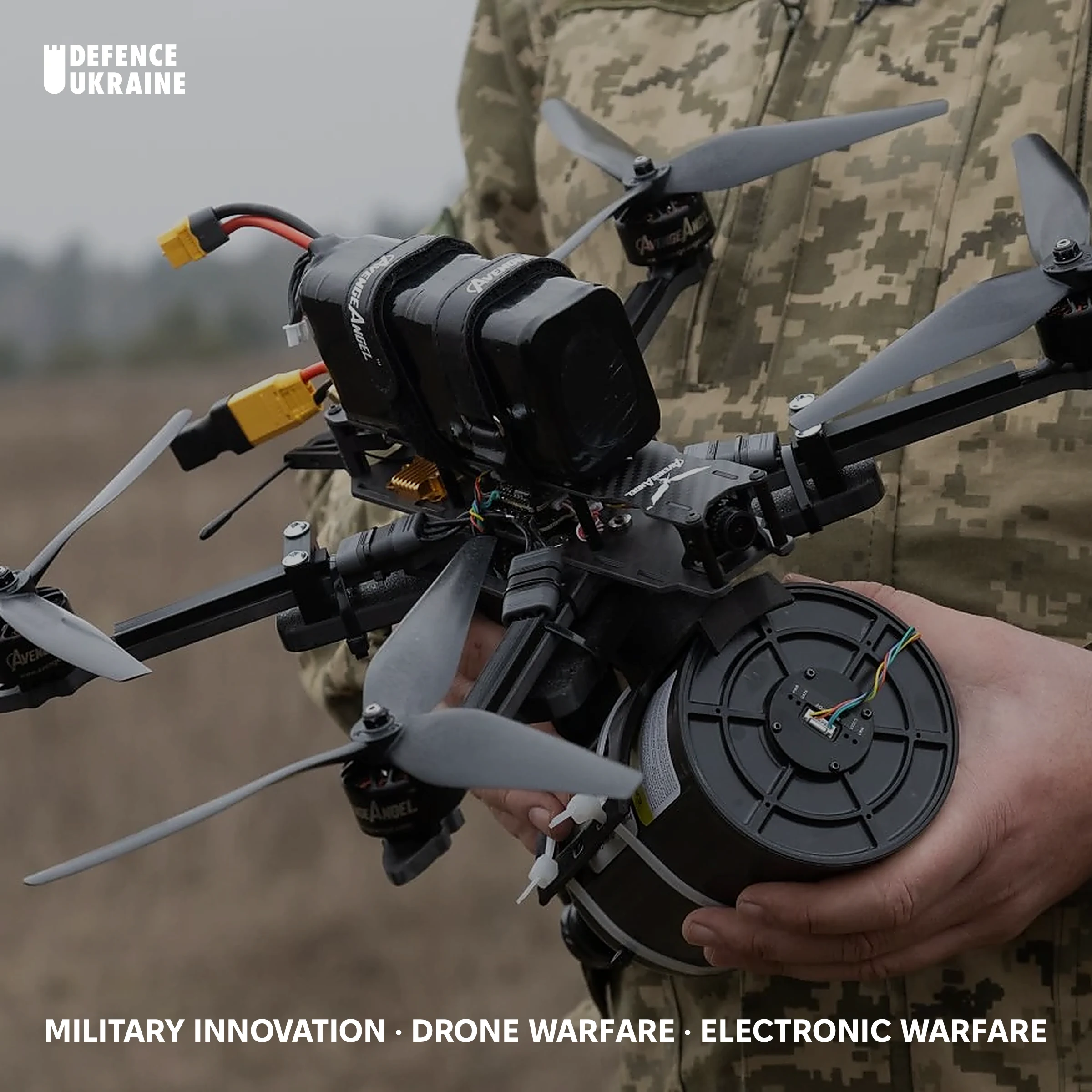 A Ukrainian soldier holds a fibre-optic FPV drone and its trailing fibre spool during Army Inform field testing, February 2025, the platform class that renders radio-frequency jamming irrelevant.