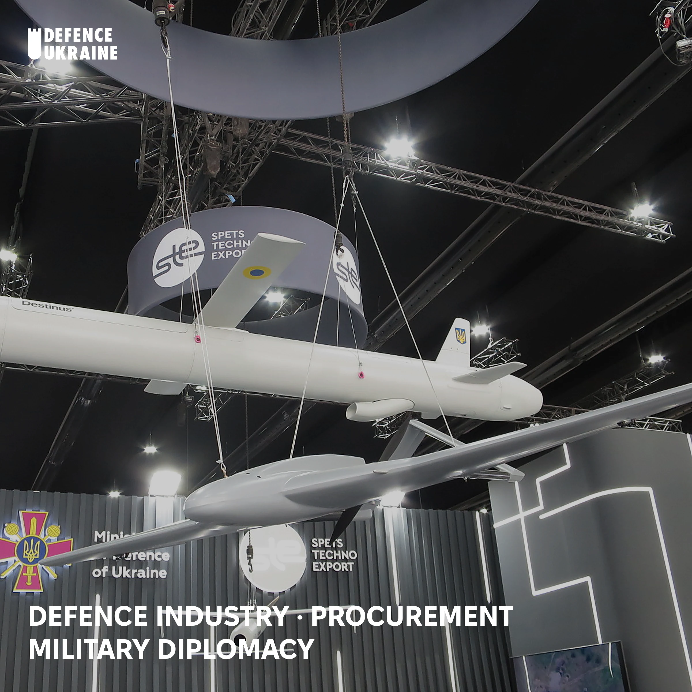 A Destinus cruise missile and a Chaklun unmanned aerial vehicle suspended above the Ukrainian Ministry of Defence and SpetsTechnoExport stand at the IDEX 2025 international defence exhibition.